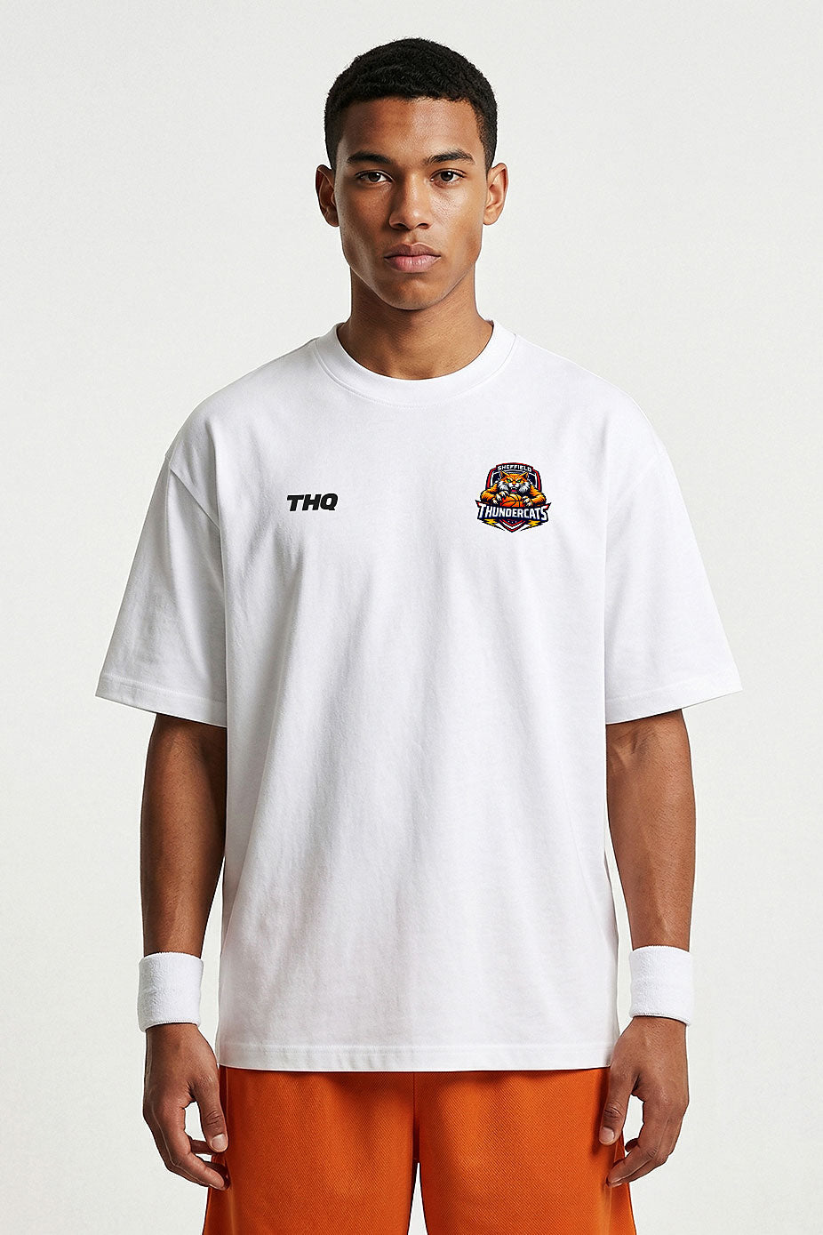 Athlete wearing a white oversized T-shirt with a THQ logo and Thundercats logo on a white background