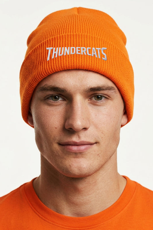Model wearing the Sheffield Thundercats orange knit beanie with white embroidered club name.